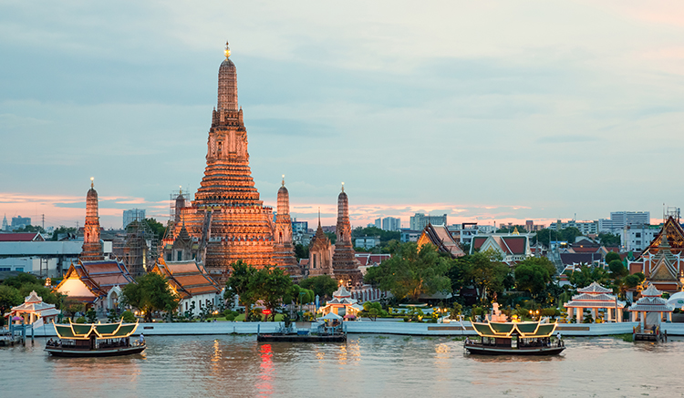 Wat Arun and cruise ship in night ,Bangkok city ,Thailand